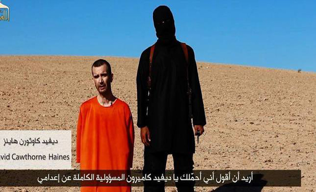 A video grab showing British aid worker David Haines with the militant who executed him. A video grab showing British aid worker David Haines with the militant who executed him.
